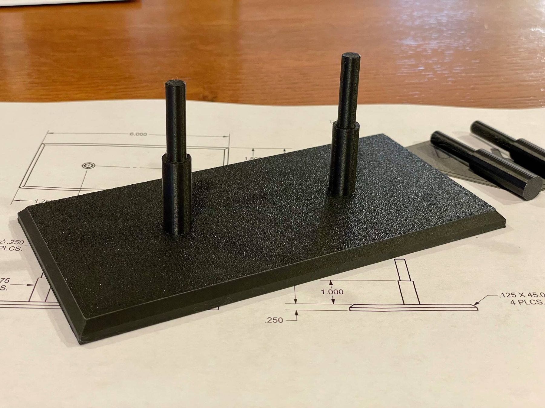 A 3D printed part on an engineering drawing